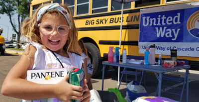 Volunteers of all ages help out at Stuff the Bus